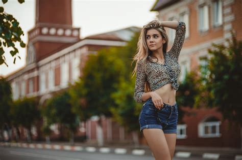 wallpaper model portrait crop top jean shorts belly button looking away sunglasses