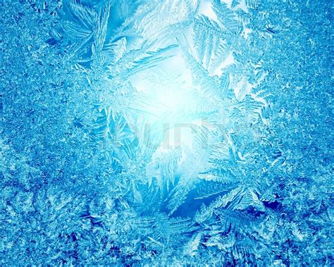 Blue Frost Winter Background With White Snowflakes Stock Photo