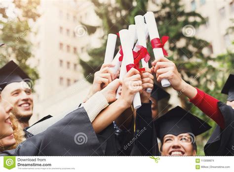 A Group Of Graduates Celebrating Stock Photo Image Of Multiracial
