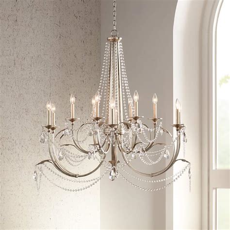 The leaves are set by hand, so this lampshade is unique in its through the gap of 2,5 cm between the lamp and the ceiling the lamp has a nice corona which lights up the lamp and the room additionally. Strand 46" Wide Silver Leaf 12-Light Chandelier - #9H385 ...