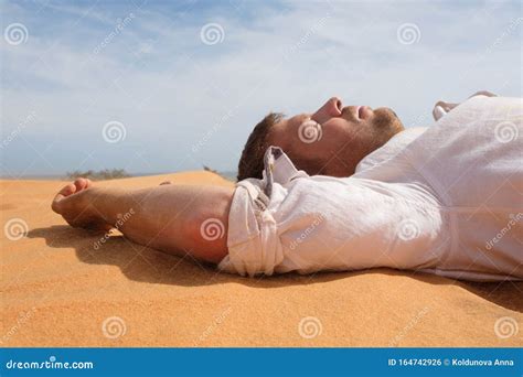 Tired Man Lying On The Sand In A Desert Stock Photo Image Of Light
