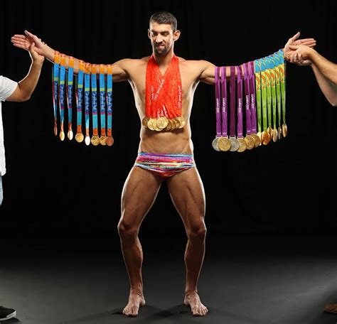 Michael Phelps Wears All His 23 Gold Medals For Sports Illustrated Magazine Cover Photos