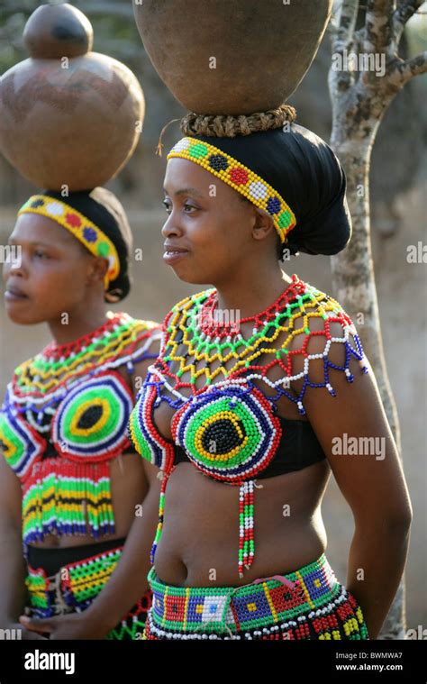 Zulu Girls Wearing Traditional Beaded Dress And Carrying Pots On Their Heads Shakaland Zulu