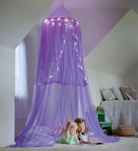 Canopy tents offer a quick, easy, and practical way to get shade, promote a business, or just add a new place to enjoy the outdoors. Purple lighted canopy | Girls room decor