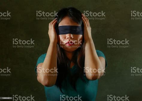 Young Scared And Blindfolded Asian Chinese Teenager Girl Lost And Confused Playing Dangerous
