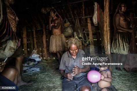 A Woman From The Dani Tribe With Amputated Fingers Makes A News Photo Getty Images