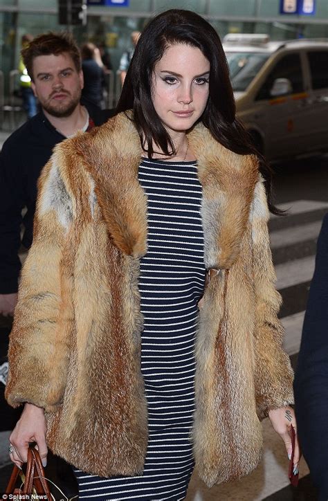 Lana Del Rey Throws On A Fur Coat And Heavy Black Boots As She Steps