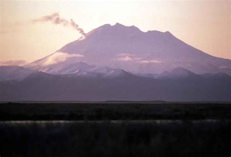 Klyuchevskaya sopka is the highest volcanic mountain standing at 15,584 feet above sea level, and it is the largest active volcano in the northern hemisphere. Free picture: alaska, peninsula, smoking, volcano