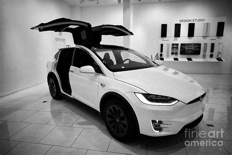 White Tesla Model X With Falcon Wing Doors Open During Celebration