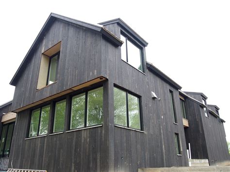 Black Vertical Cedar Siding And Black Clad Windows House Exterior