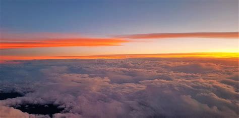 Breathtaking View Of Beautiful White Clouds Seen From Above At Sunset