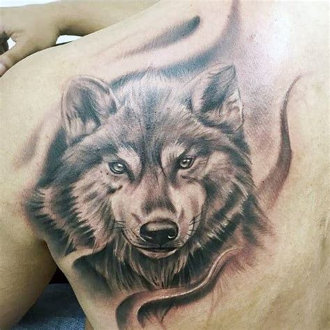 While most ideas focus on realistic depictions, some ink concepts incorporate tribal styling or an artistic approach. 40 Wolf Back Tattoo Designs For Men - Fierce Ink Ideas