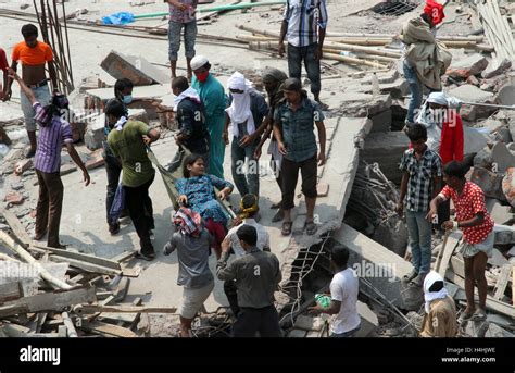 Bangladeshi People Gather As Rescuers Look For Survivors And Victims At The Site Of Rana Plaza