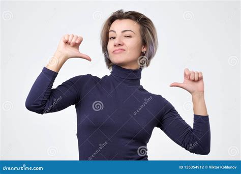 Woman Looking Confident With Smile On Face Pointing Herself With