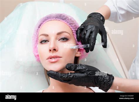 Cosmetic Treatment Closeup Beautician Hands Doing Facial Skin Lifting