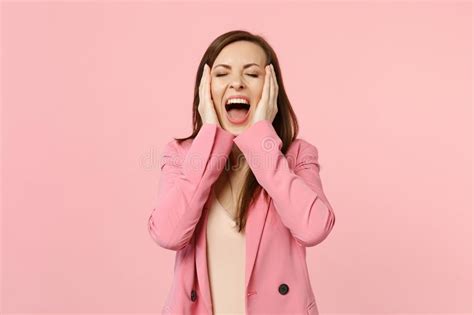 Portrait Of Crazy Screaming Young Woman In Jacket Keeping Eyes Closed