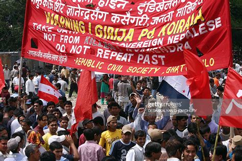 Nepalese Pro Democracy Activists Hold Banners As They March On Their