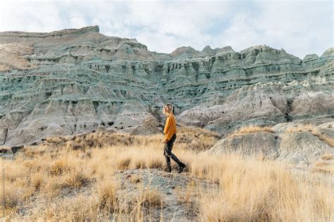 Woman Walking Through Desert Area By Stocksy Contributor Jesse