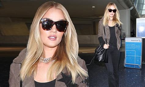 Rosie Huntington Whiteley Shows Off Her Long Legs As She Jets Home To