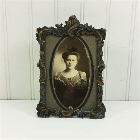 Ornate Cast Metal Frame With Gold Details With Woman Portrait