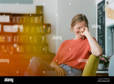 Happy Young Woman Sitting In A Cafe Stock Photo Alamy