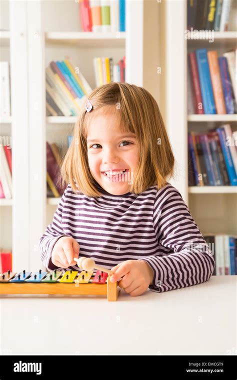 Portrait Of Happy Little Girl Playing Xylophones Stock Photo Alamy