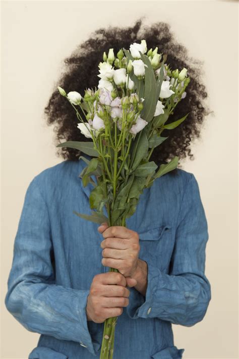 A Person Holding White A Flower Bouquet Covering The Face Pixeor