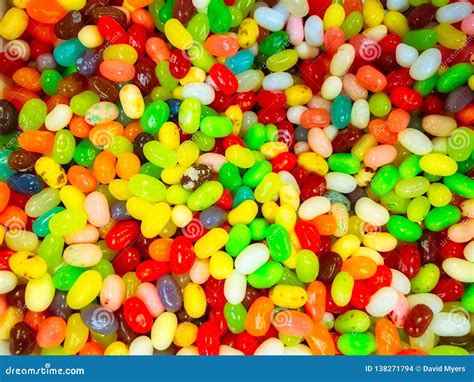 Candy `jelly Beans` In Bulk Container Rainbow Of Colors Stock Photo