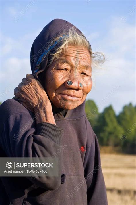 Elderly Woman Of The Apatani Ethnic Group Known For The Pieces Of Wood In Their Nose To Make