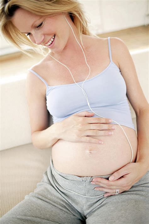Pregnant Woman Listening To Music Photograph By Ian Hootonscience