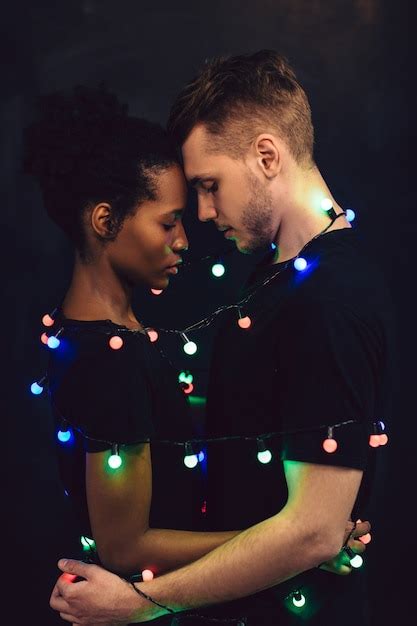 Premium Photo Interracial Young Couple Tied Together With Sparkling