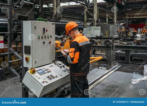 Operator Working With Cnc Machine In Metalworking Workshop Editorial