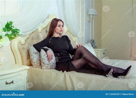 Portrait Of Beautiful Young Brunette Woman Sitting In Bedroom Stock Image Image Of Brunette
