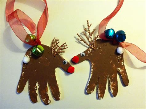 Two Handprinted Reindeers With Bells On Them