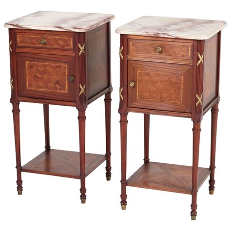 Large bedroom set that includes a bed and other pieces of furniture made of wood with mahogany finish. Pair of French Louis XV Style Mahogany Nightstands or ...