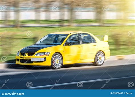 Mitsubishi Yellow Sports City Car At High Speed Road Russia Saint