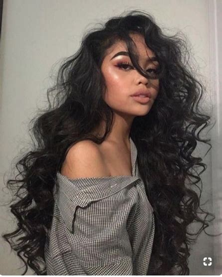 Beautiful Woman In A Grey Shirt With Super Long Curly Black Hair