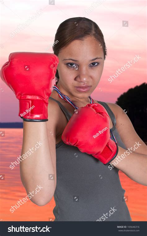 Beautiful Young Black African American Woman Wearing A Pair Of Boxing