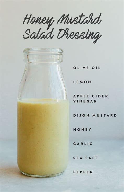 A Glass Jar Filled With Liquid Sitting On Top Of A White Counter Next To The Words Honey Mustard