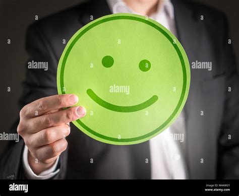 Business Man With Happy Cardboard Smiley Face Emoticon Customer