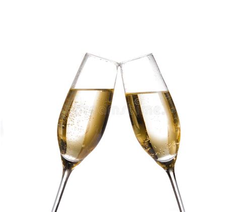 Two Champagne Flutes With Golden Bubbles Make Cheers On White