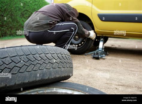 Man Changing A Tire Stock Photo Alamy