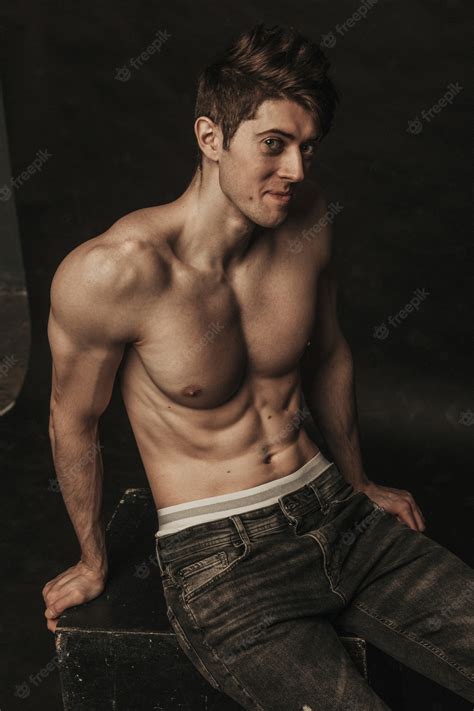 Premium Photo Athletic Cute Man Posing Topless In Jeans