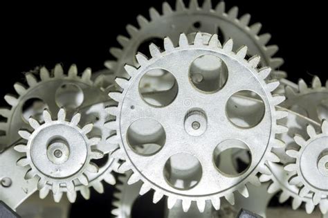 Close View Of Old Clock Mechanism With Gears And Cogs Stock Photo