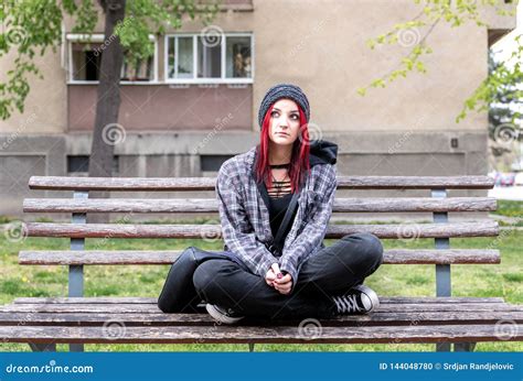 Homeless Girl Young Red Hair Girl Sitting Alone Outdoors With Hat And Shirt Anxious And