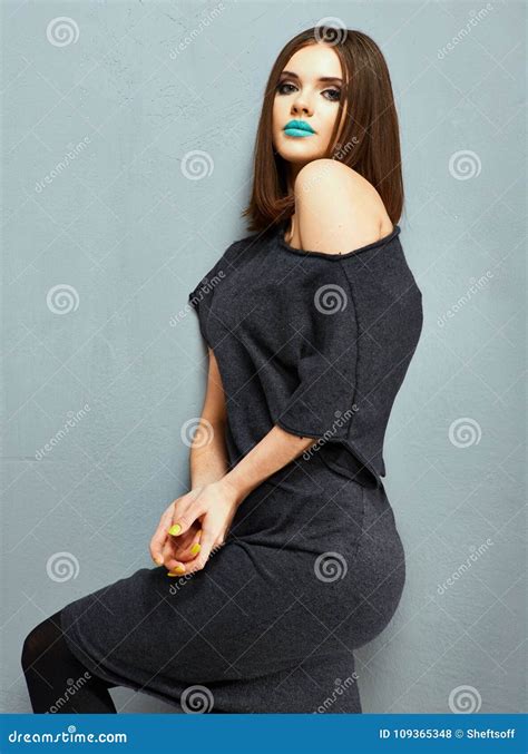 Young Woman Posing On Against Gray Stock Photo Image Of Person Model