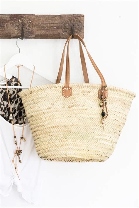 This basket is large enough for groceries and will make an amazing picnic basket or beach bag as well. 15 Favorite French Market Baskets | Glitter, Inc.
