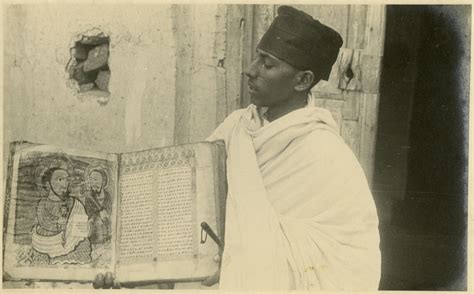 Priest With Illustrated Bible At Monastery Of The Eritrean Orthodox