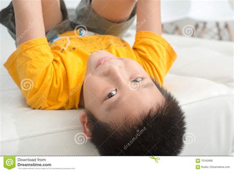 Asian Boy Resting Comfortably On His Bed Stock Photo Image Of Child