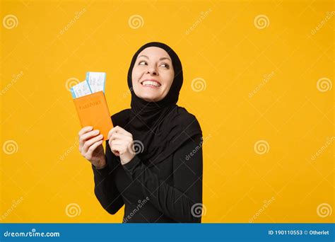 Traveler Tourist Young Arabian Muslim Woman In Hijab Black Clothes Hold Passport Tickets